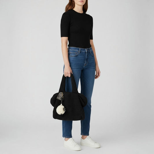 Brandsamsara black knitted shoulder bag with leather details and a sheep charm. Features cotton lining and leather bottom panel.