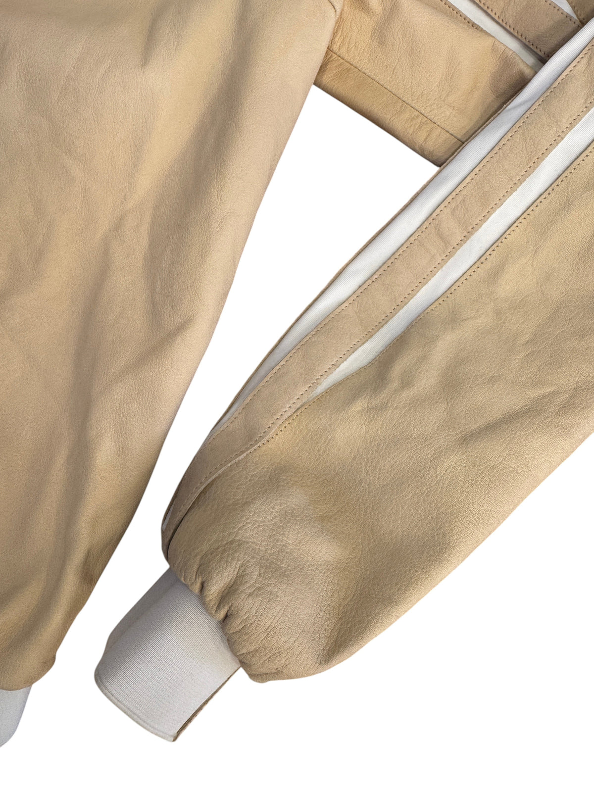 Brandsamsara Jitrois beige nylon blend jacket sleeve with white trim detail and ribbed cuff