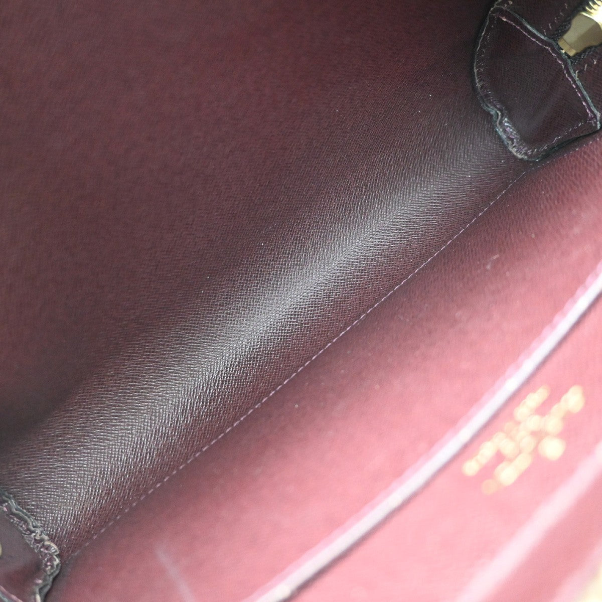Louis Vuitton Pochette Baikal Clutch Taiga Leather, Burgundy, Leather, Clutch