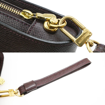Louis Vuitton Pochette Baikal Clutch Taiga Leather, Burgundy, Leather, Clutch