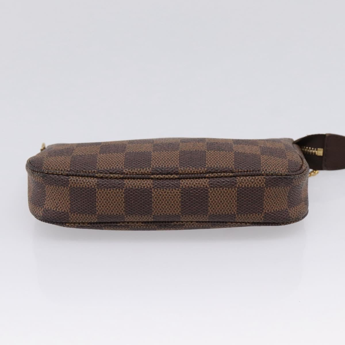 Louis Vuitton Mini pochette accessoires Damier Canvas, Brown, Canvas, Clutch