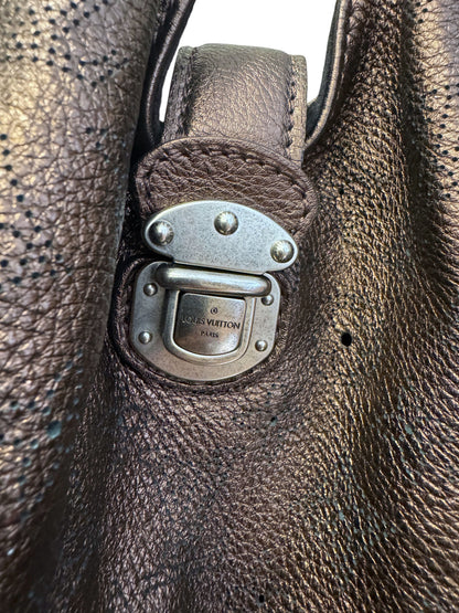 Brandsamsara Louis Vuitton Mahina XL bag featuring brown lasercut monogram leather and silver-tone push-lock hardware