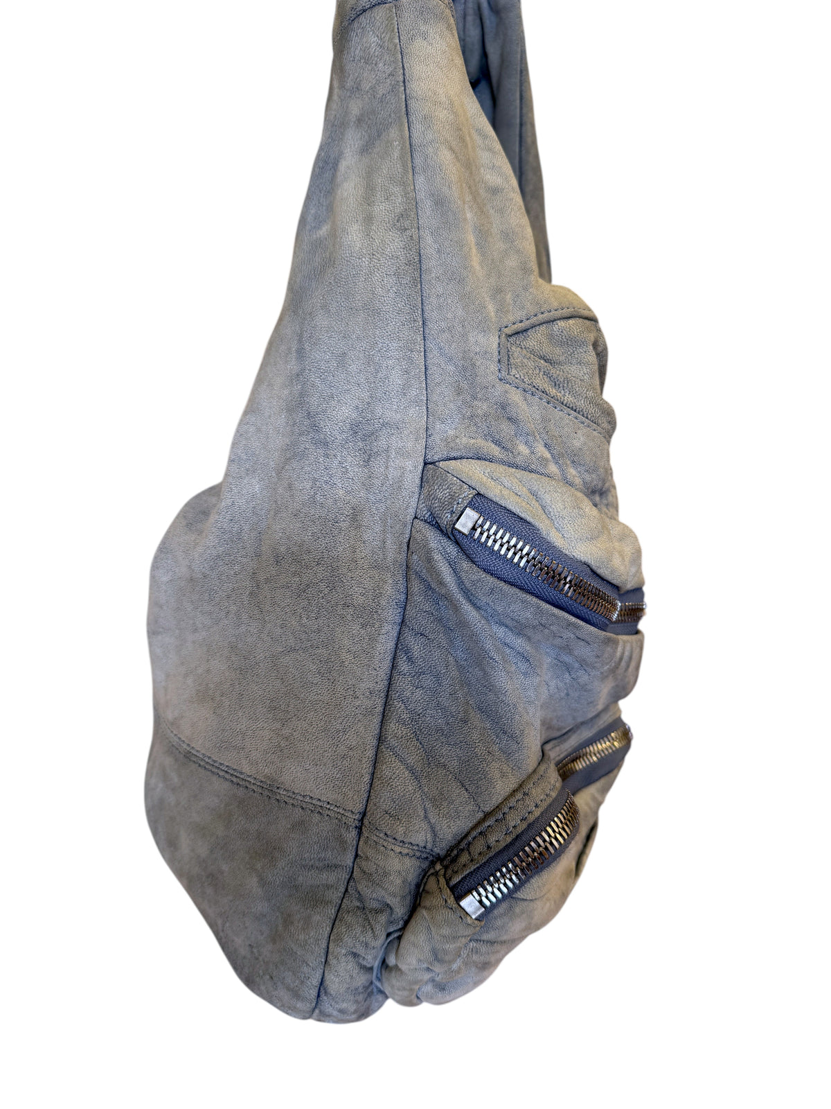Brandsamsara Alexander Wang blue distressed suede shoulder bag with silvertone zip pockets hanging on a rack
