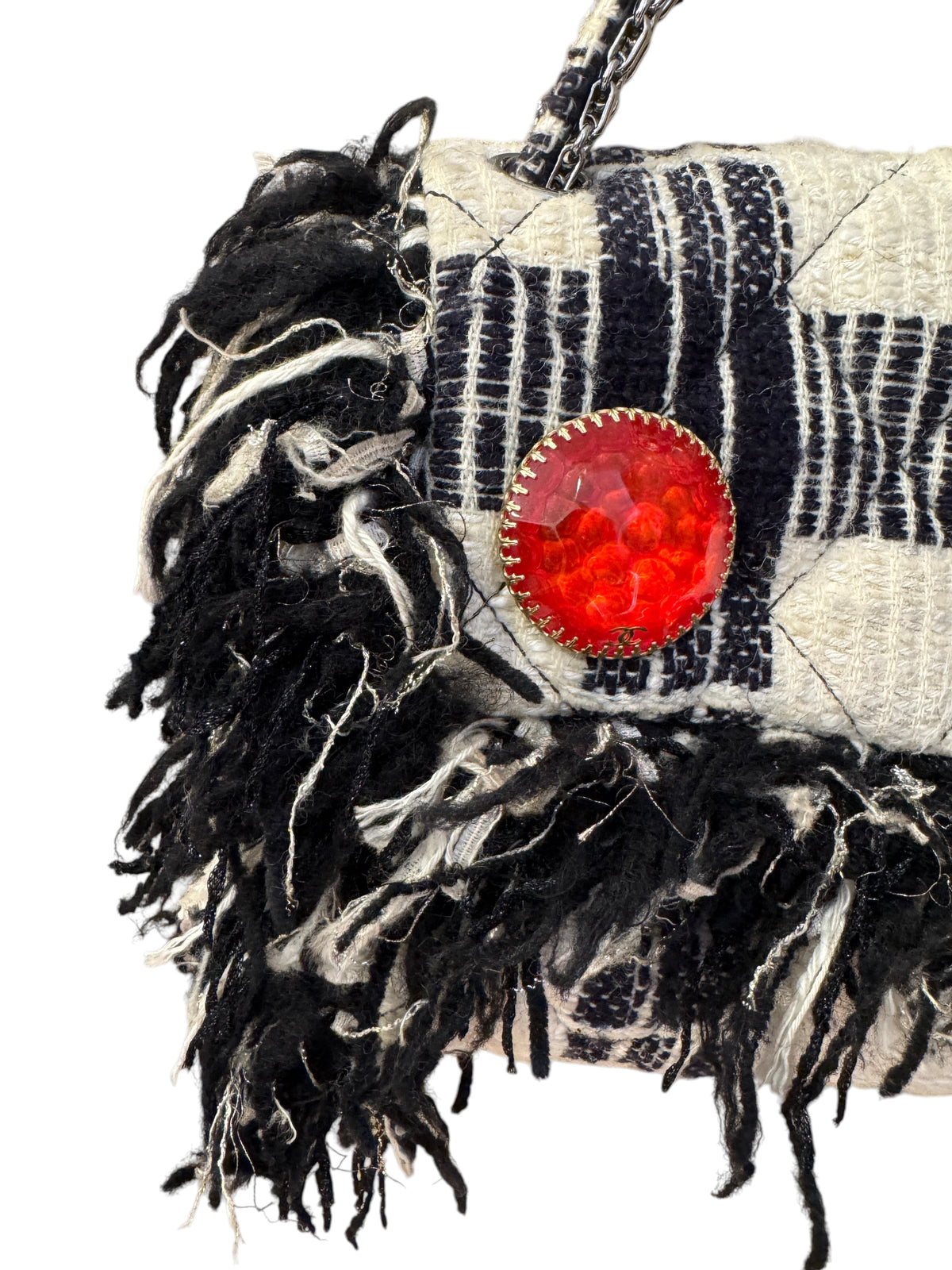 Brandsamsara vintage Chanel flap bag in black and white tweed with fringe trim and a large red jeweled brooch