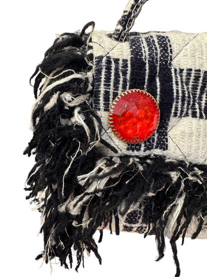 Brandsamsara vintage Chanel flap bag in black and white tweed with fringe trim and a large red jeweled brooch