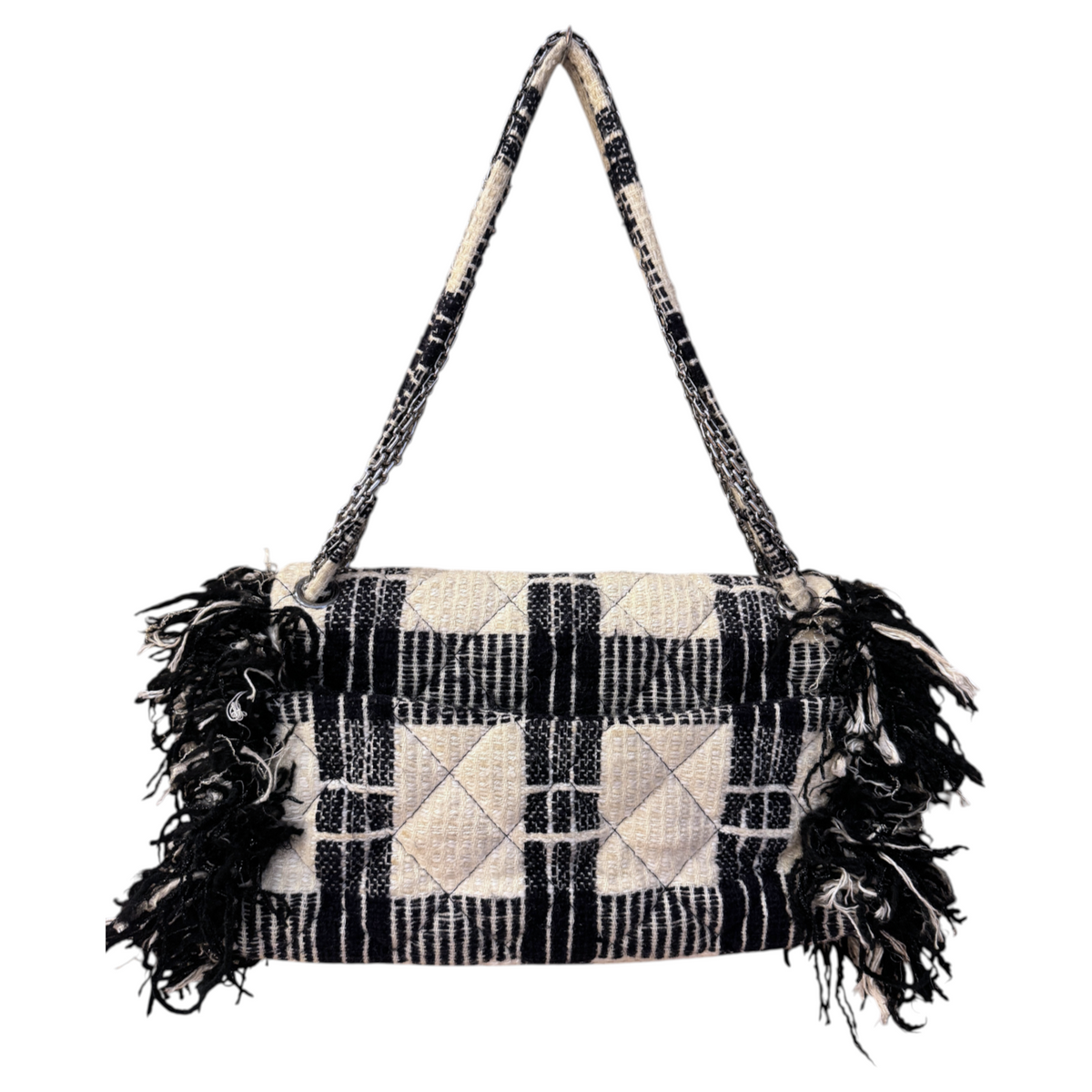Brandsamsara vintage Chanel flap shoulder bag in black and white plaid tweed with fringe trim and chain strap.