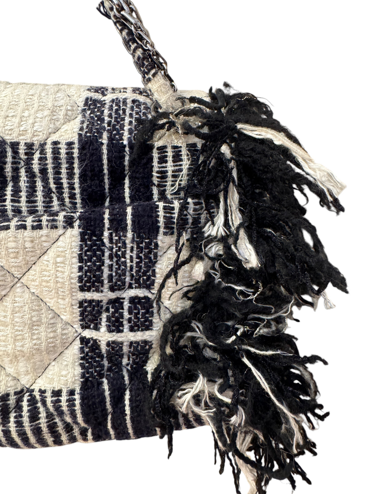Brandsamsara vintage Chanel flap shoulder bag in black and white tweed with fringe trim and chain strap