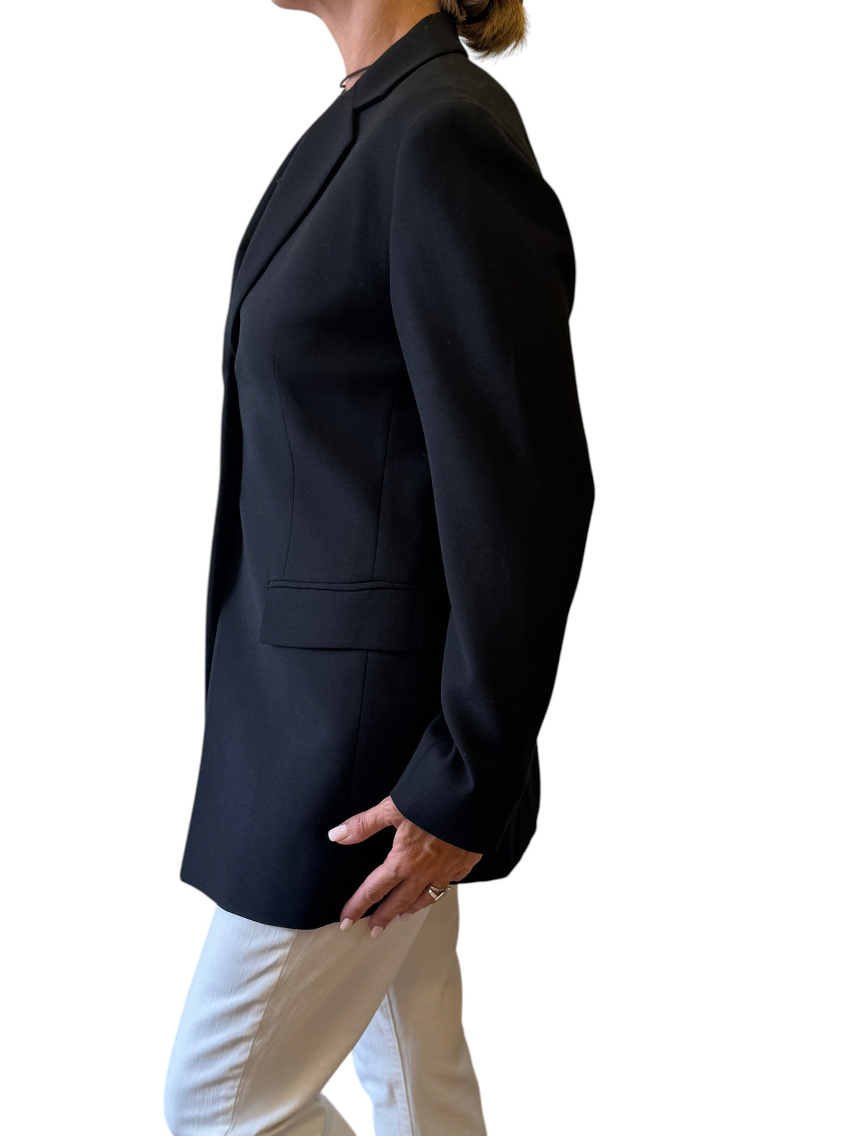 Brandsamsara black wool blazer jacket with long sleeves and lining, worn by a model in a side profile view.