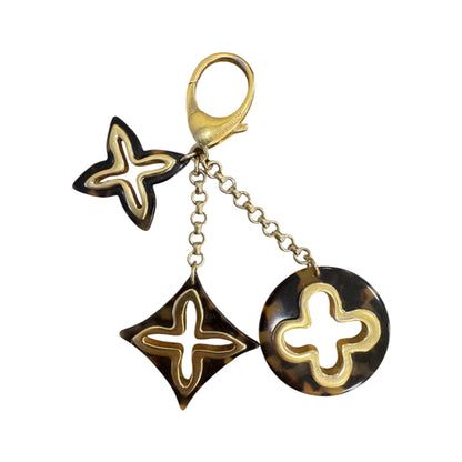 Brandsamsara Louis Vuitton Bijoux Sac Insolence bag charm in gold-tone brass and brown tortoise shell resin acetate