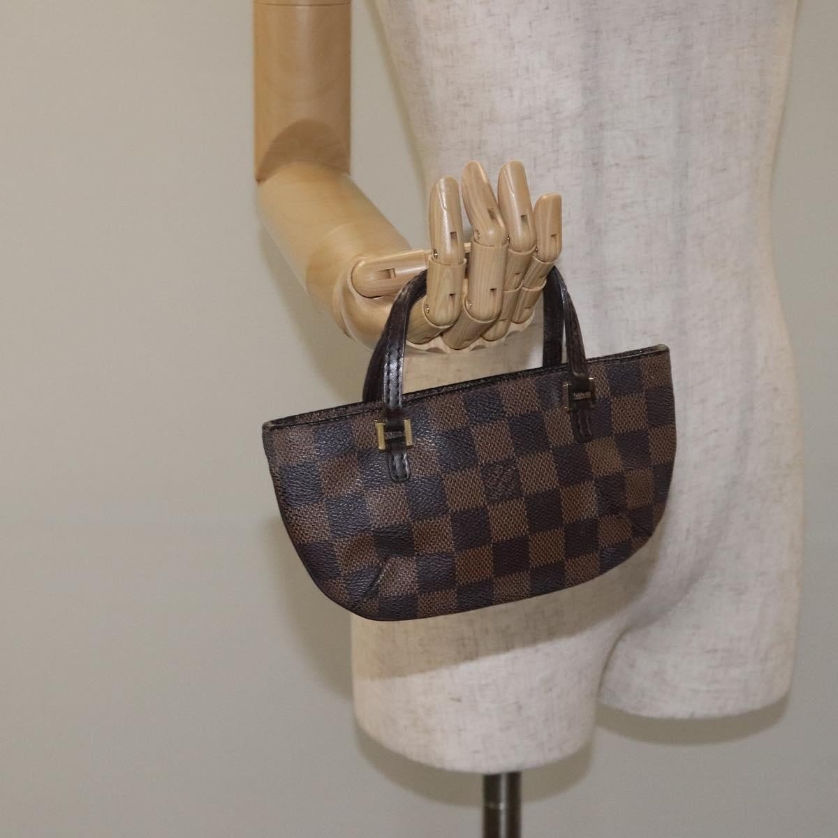 Louis Vuitton Manosque Pochette - Brandsamsara