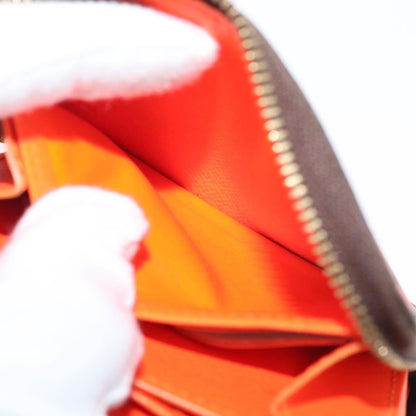Louis Vuitton Porte-Monnaie Zippy Wallet monogramme empreinte, Orange, Canvas, Wallet