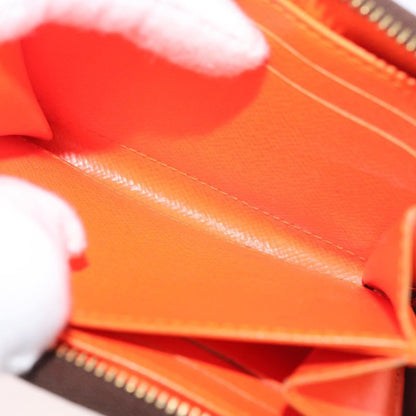 Louis Vuitton Porte-Monnaie Zippy Wallet monogramme empreinte, Orange, Canvas, Wallet