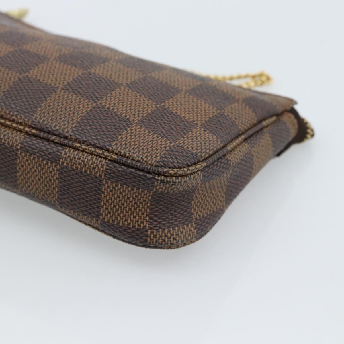 Louis Vuitton Mini pochette accessoires Damier Canvas, Brown, Canvas, Clutch