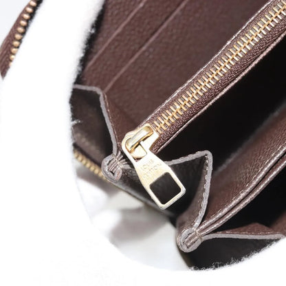 Louis Vuitton Zippy Wallet NM Leather Empreinte, Brown, Leather, Wallet